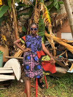Helia Dress in Hocus Pocus print, in an outdoor setting, highlighting the dress’s colorful 3 way print.