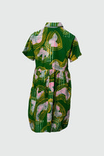 Back view of the short-sleeved Helia Dress with cinched waist, bold green-pink-yellow print, and shirt-style collar.