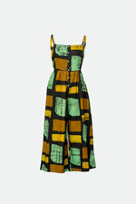 Sleeveless Mafalda Jumpsuit in abstract Pistacia print with green, black, and yellow blocks on a ghost mannequin.