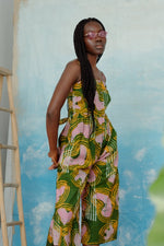 Mafalda Jumpsuit, Waters print, vibrant ladder backdrop, green/yellow/pink pattern, wide culotte legs, hand dyed in Ghana.