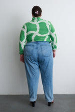 Back view of Osei-Duro Stricta Turtleneck in Mangrove print, paired with light blue jeans, showcasing the batik design.