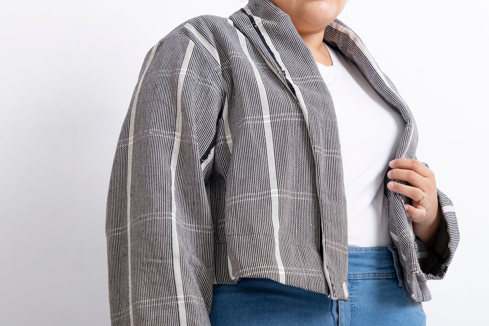 Handwoven cotton Abiba Jacket in Guinea Fowl: a stylish and unique piece with intricate stip-weaving.