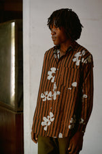 Casual Bula Shirt in Ruga print against white wall, floral stripes, against a white backdrop.