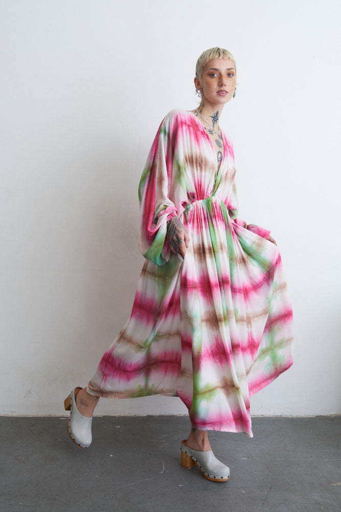 Serene Dreams Bata Dress with dynamic flow, captured mid-motion, paired with stylish white clogs.