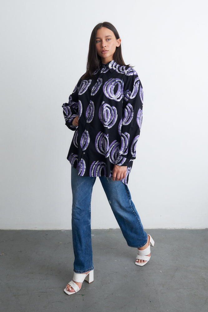 Stylish Bula Shirt with Good Signal print, paired with classic jeans and white heeled sandals for a smart look.