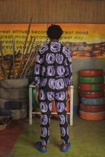Back view of the vibrant Bula Shirt with Good Signal print, paired with creative backdrop, inspiring a great life.