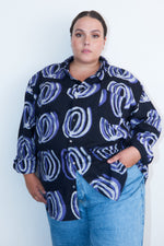 Chic Bula Shirt with distinctive Good Signal pattern, paired with casual jeans for a relaxed yet stylish look.