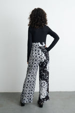 Latus Trousers in 2 Party System print, featuring a bold black and white pattern, perfect for a statement outfit.