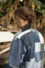 Back view of the Nimes Jacket, showcasing the different tones of denim patches.
