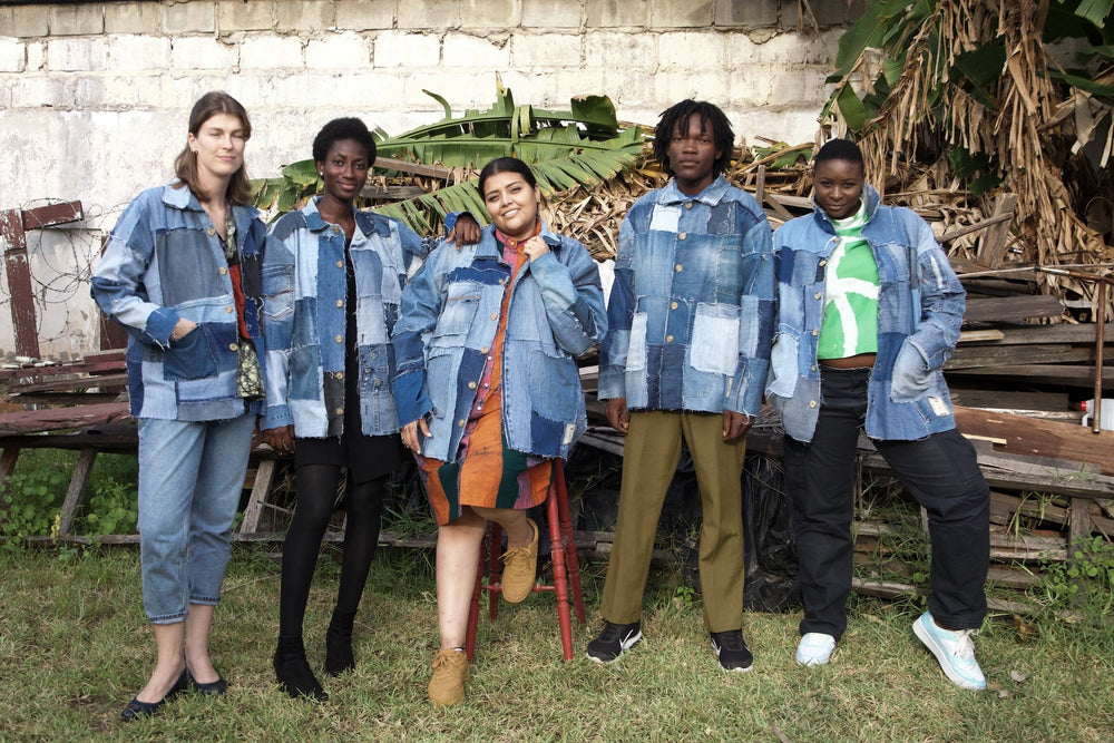 Group of people wearing the Nimes denim patchwork jacket, showcasing its versatility.