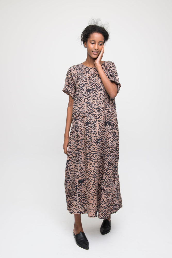 Elegant Nonna Dress in Snakebite print, full-length with short sleeves, paired with black shoes, against white backdrop.