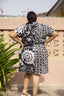 Back view of oversized cotton dress in 2X size with a black and white abstract flower and grid batik pattern.