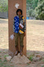 Split print Bula Shirt in blue/white and multicolored print, paired with olive pants and brown boots, for a casual outdoor look.