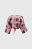 Epo Tie Top in pink with dark green organic shapes print, long sleeves, tie waist, showcased on a plain background.