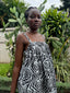 Close-up front view of Saya Dress in Long Division print, showcasing shirring around the bust, outdoor cacti backdrop.