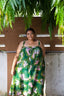 Model wearing the Saya Dress in Waters print, standing outdoors under a tree, showcasing the front of the dress.