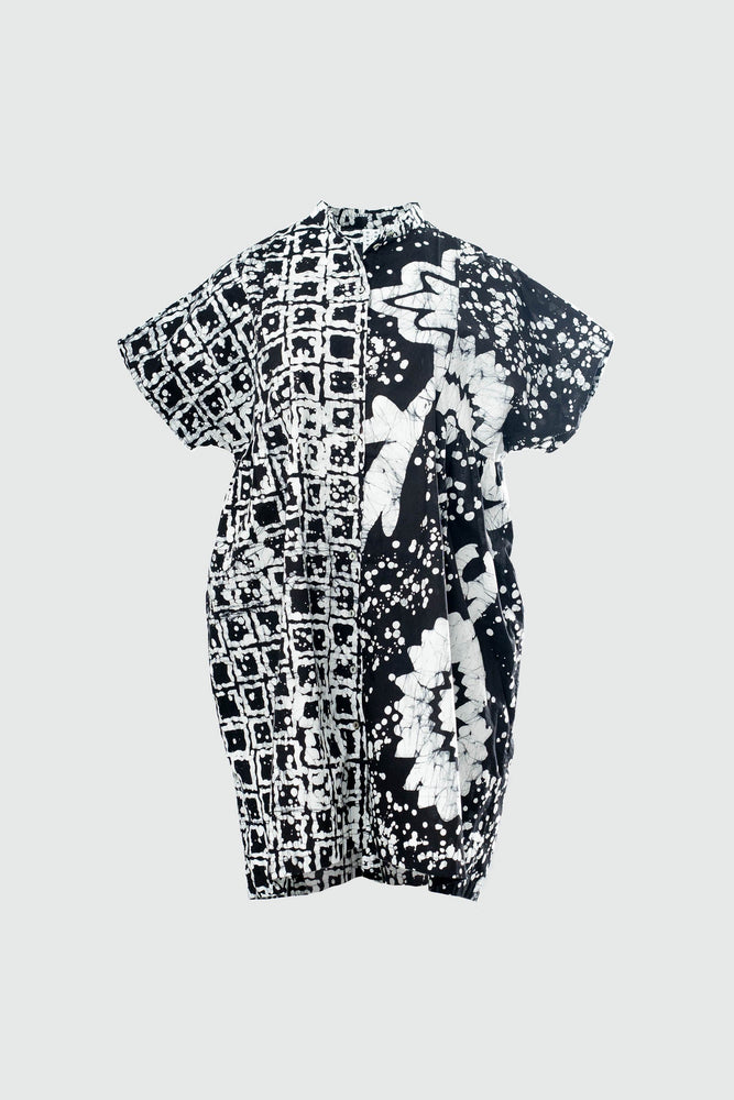 Back view of oversized cotton dress in small size with a black and white abstract flower and grid batik pattern.