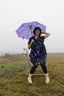 Chic Bata Dress with mandarin collar, paired with leggings and ankle boots, in a misty outdoor setting.