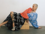 Artistic Bating Dress with blue/white & orange/red top, black and blue skirt, highlighted by visible tattoos.