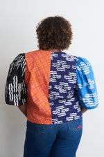 Back view of the Flos Blouse in the hand-dyed batik print Directions. Ethically made in Ghana.