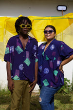 A woman in size 3 and a man in size 2 wearing the rayon Holiday Shirt in dark purple and geometric shapes print.