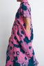 Side view of Imperium Dress in pink and blue Pool Party print, showcasing the airy fabric and abstract design.
