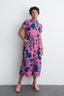 Vibrant Pool Party print Imperium Dress, highlighting its loose fit, short sleeves, and functional inseam pockets.