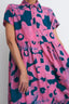 Imperium Dress in vibrant pink and blue Pool Party print, featuring a formal yet casual style with a collar and buttons.