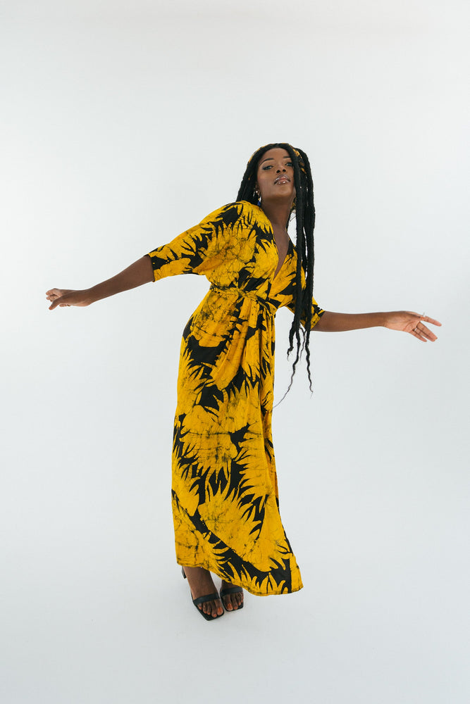 Dynamic Letsa Dress in Aden print, capturing the fluidity and elegance of the hand-dyed design with batwing sleeves.