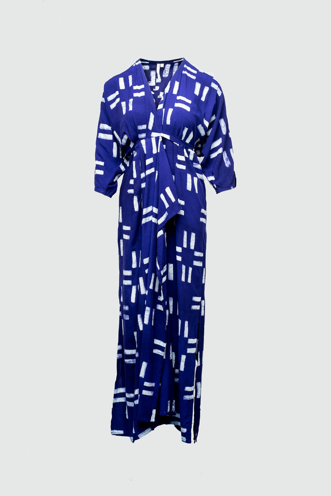 Blue Letsa Dress with abstract white print, V-neckline, short sleeves, cinched waist, displayed against a light background.