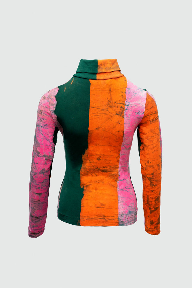 Color block Stricta Turtleneck with green, pink, and orange sides, with marbled textured pattern, snug in cotton spandex.