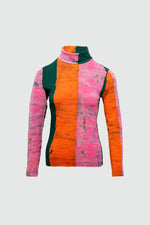 Snug Stricta Turtleneck with bold striped pink, orange, and green design, crafted from cozy cotton spandex.