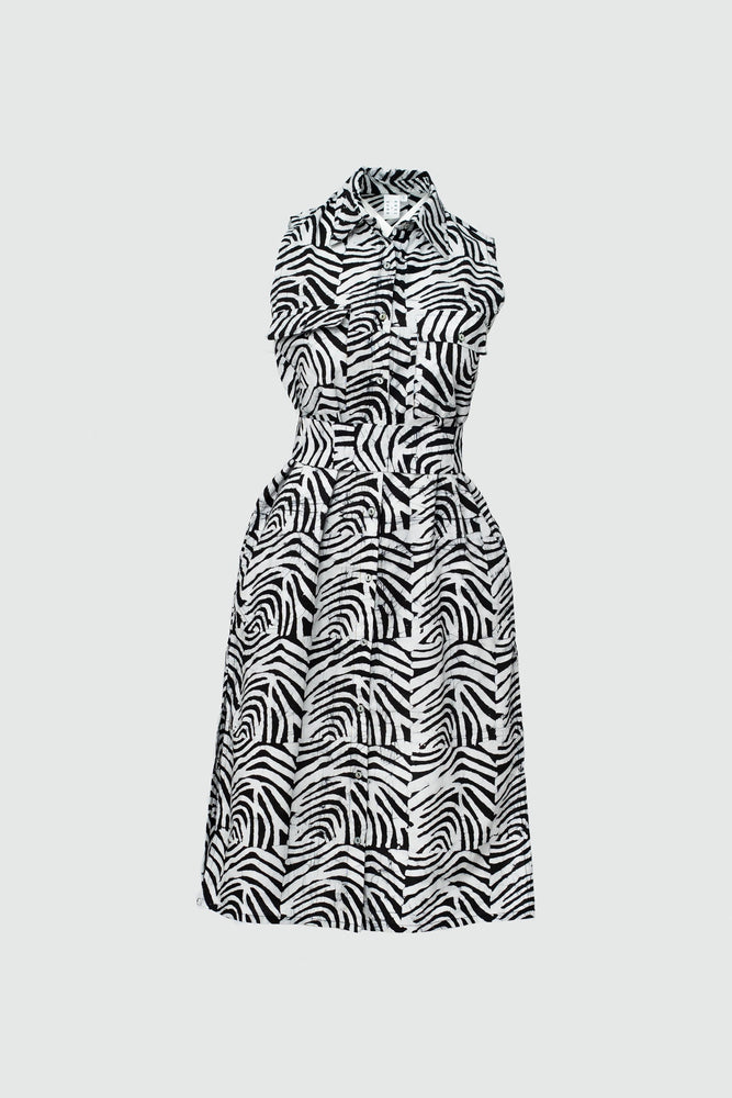 A cotton shirtdress with a collar, button front and optional belt a black and white resembling zebra or wood grain.