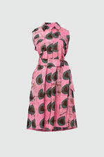 Front view of a cotton sleeveless shirtdress with A-line skirt, a batik dyed pink dress with abstract dark green shapes.
