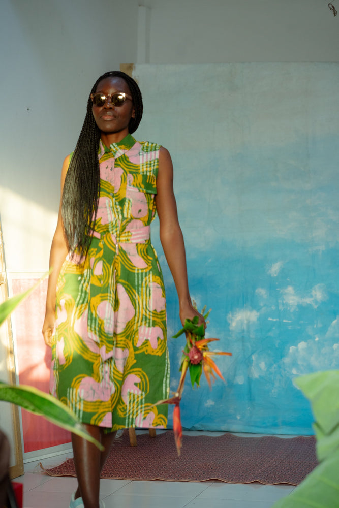 The dress worn by a model, exuding a carefree and summery vibe.